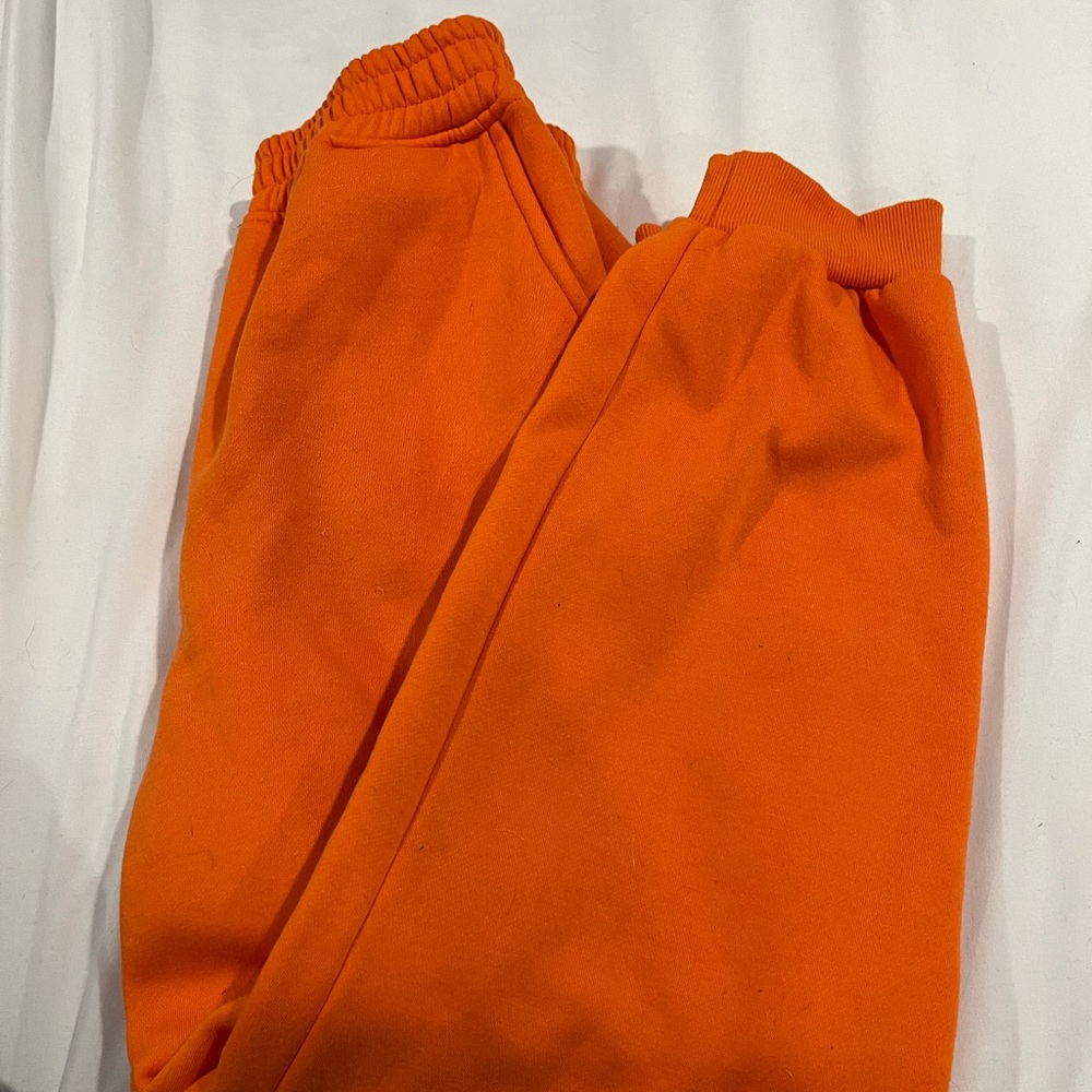 orange sweatpants size medium (no tag)